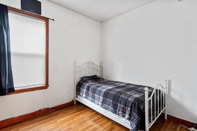 bedroom featuring wood-type flooring