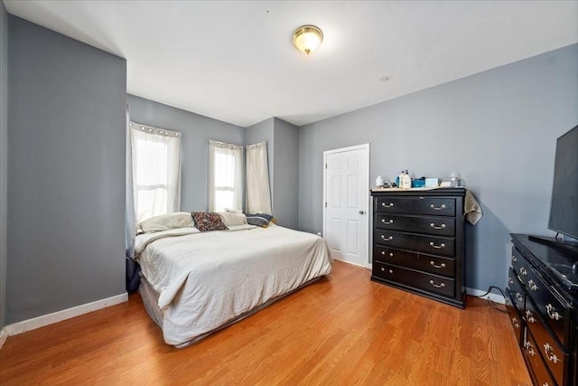 bedroom with light hardwood / wood-style flooring