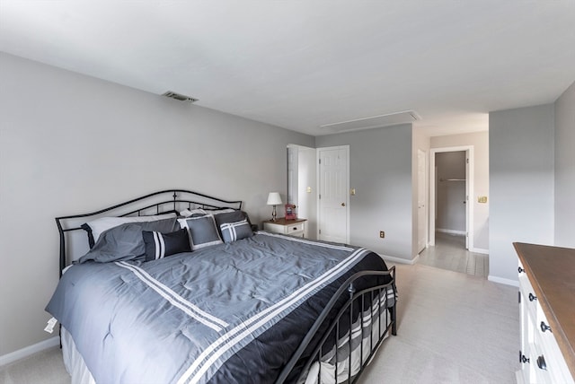 bedroom with light colored carpet