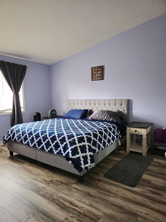bedroom with wood finished floors