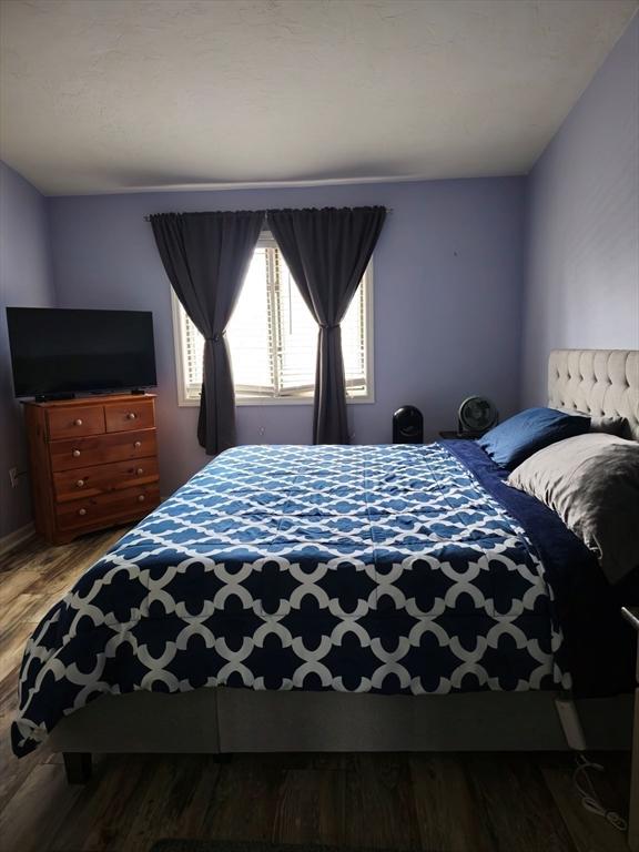 bedroom featuring wood finished floors