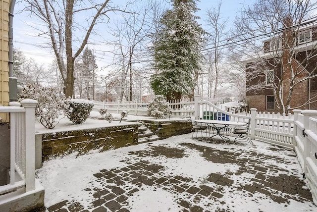 view of yard layered in snow