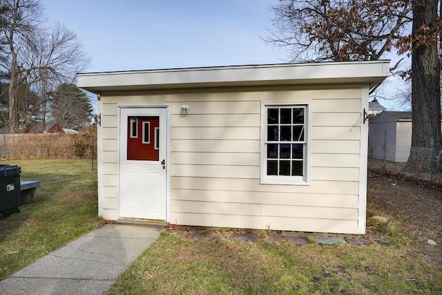 view of outbuilding with a lawn