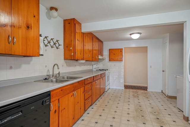 kitchen featuring white range with gas stovetop, dishwasher, and sink