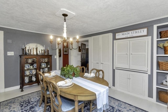 685 Main St, Wilbraham, MA 01095 - dining space with a chandelier, a textured ceiling, ornamental molding, and baseboards