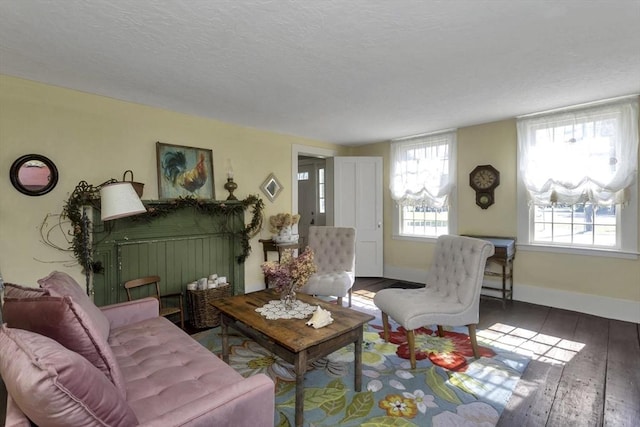 685 Main St, Wilbraham, MA 01095 - living area with wood-type flooring, a textured ceiling, and baseboards