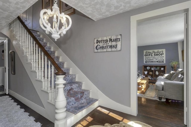 685 Main St, Wilbraham, MA 01095 - stairway with wood finished floors, baseboards, and a chandelier