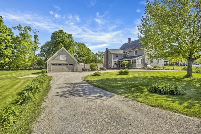 685 Main St, Wilbraham, MA 01095 - view of front of house with a garage and a chimney