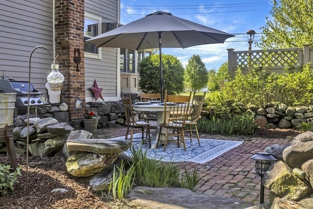 685 Main St, Wilbraham, MA 01095 - view of patio with fence, outdoor dining space, and a grill