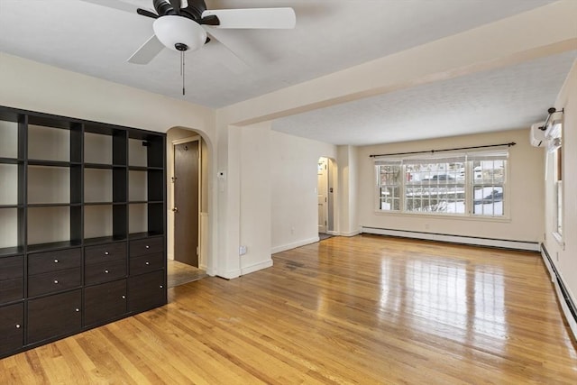 unfurnished living room featuring ceiling fan, a baseboard radiator, and light wood-type flooring