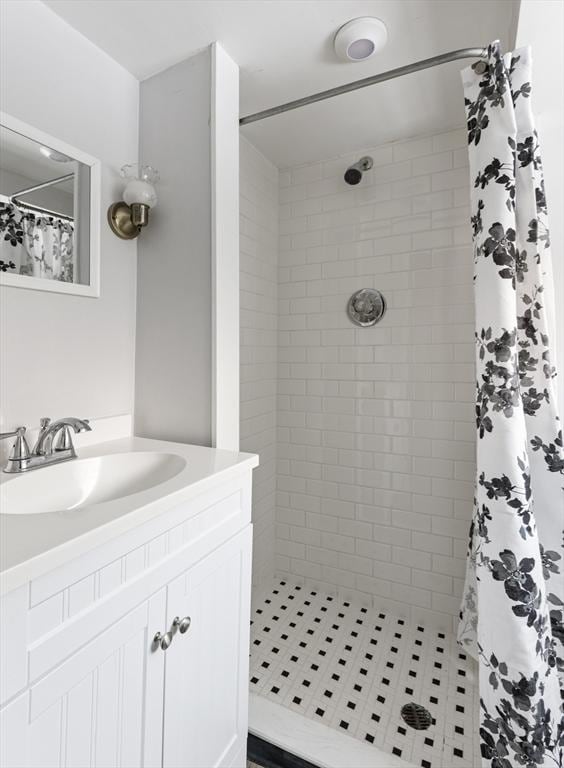 bathroom featuring vanity and a shower with shower curtain