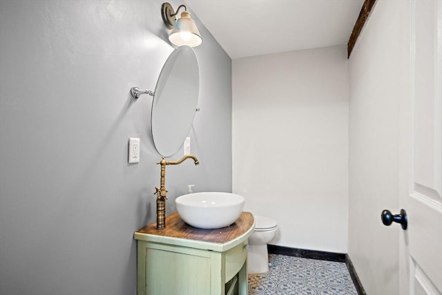 11 Worcester Pl, Holbrook, MA 02343 - half bath featuring vanity and tile patterned floors