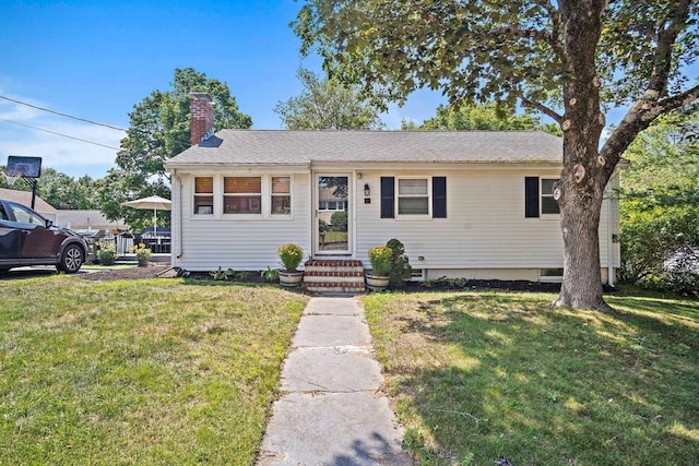 11 Worcester Pl, Holbrook, MA 02343 - view of front facade with a front yard, a chimney, and entry steps