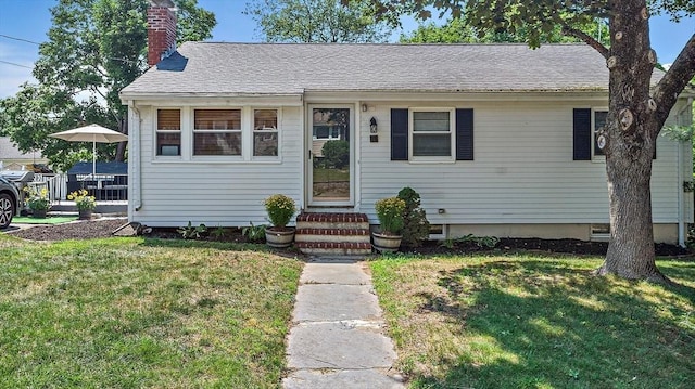 11 Worcester Pl, Holbrook, MA 02343 - bungalow-style house with a front yard, a chimney, a shingled roof, and entry steps