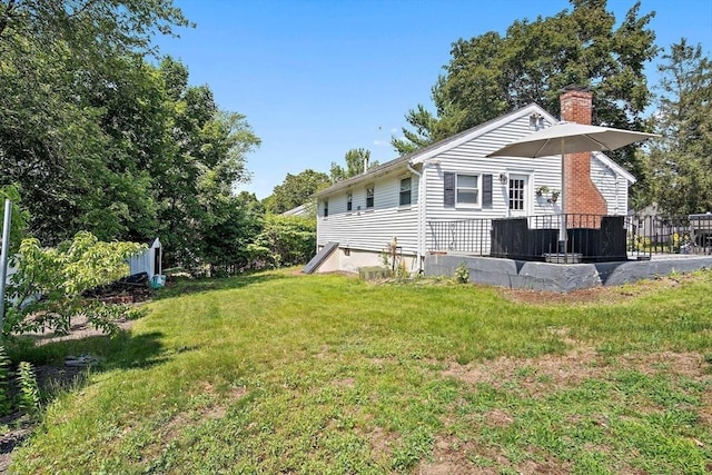 11 Worcester Pl, Holbrook, MA 02343 - view of property exterior featuring a chimney and a lawn