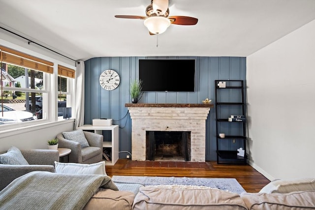 11 Worcester Pl, Holbrook, MA 02343 - living area with wood finished floors, ceiling fan, and a fireplace