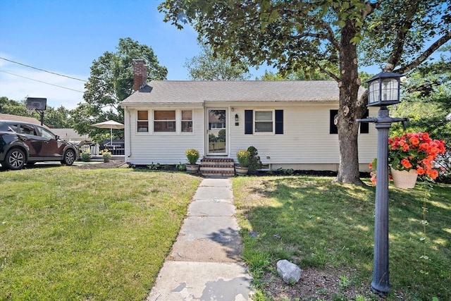 11 Worcester Pl, Holbrook, MA 02343 - view of front of house featuring a chimney and a front yard