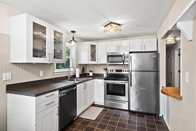 11 Worcester Pl, Holbrook, MA 02343 - kitchen with appliances with stainless steel finishes, dark countertops, white cabinets, and glass insert cabinets