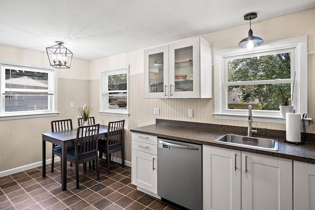 11 Worcester Pl, Holbrook, MA 02343 - kitchen with stainless steel dishwasher, dark countertops, glass insert cabinets, and white cabinets