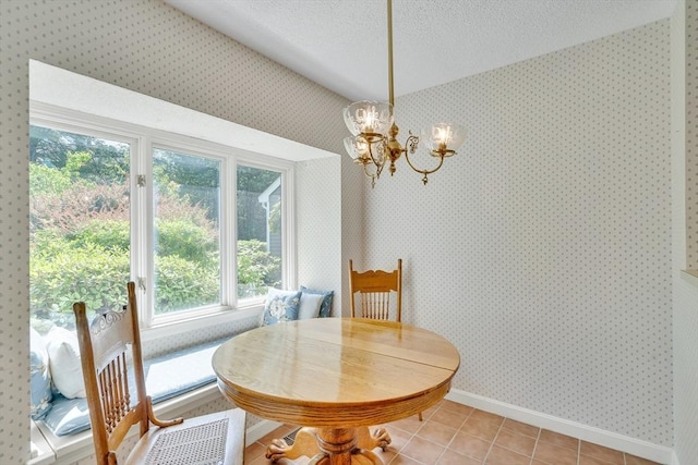 68 Bishops Forest Dr Unit 68, Waltham, MA 02452 - dining area with a chandelier, wallpapered walls, a textured ceiling, and light tile patterned floors