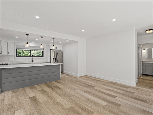 22 Chestnut Pl Unit G1, Brookline, MA 02445 - unfurnished living room featuring light wood-style flooring and recessed lighting