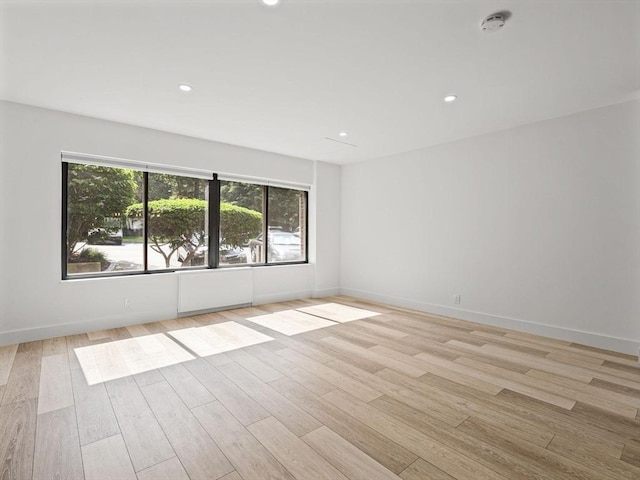 22 Chestnut Pl Unit G1, Brookline, MA 02445 - unfurnished room featuring a smoke detector, plenty of natural light, light wood-style floors, and recessed lighting