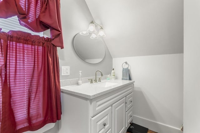 4 Myrtle Sq, Gloucester, MA 01930 - bathroom featuring vaulted ceiling, vanity, and baseboards