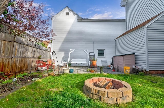 4 Myrtle Sq, Gloucester, MA 01930 - back of property with a patio area and an outdoor fire pit