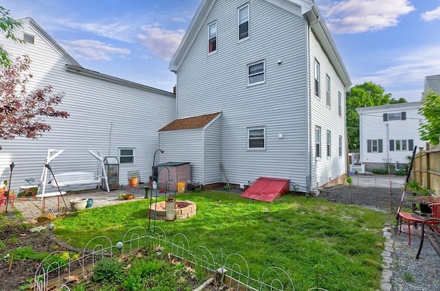 4 Myrtle Sq, Gloucester, MA 01930 - back of house featuring a fire pit and a patio area