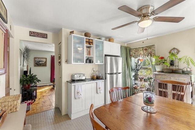 4 Myrtle Sq, Gloucester, MA 01930 - dining area with ceiling fan, baseboard heating, and light tile patterned floors