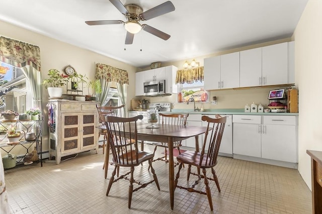 4 Myrtle Sq, Gloucester, MA 01930 - dining room featuring light tile patterned floors and ceiling fan