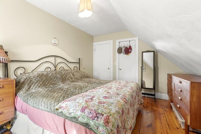 4 Myrtle Sq, Gloucester, MA 01930 - bedroom featuring vaulted ceiling, hardwood / wood-style floors, and baseboards
