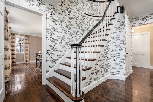 stairs with crown molding and dark wood-type flooring