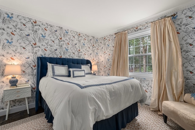 bedroom featuring crown molding and hardwood / wood-style flooring