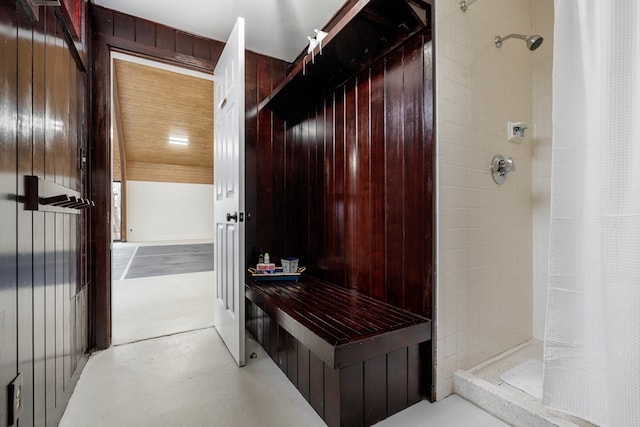 mudroom with wooden walls