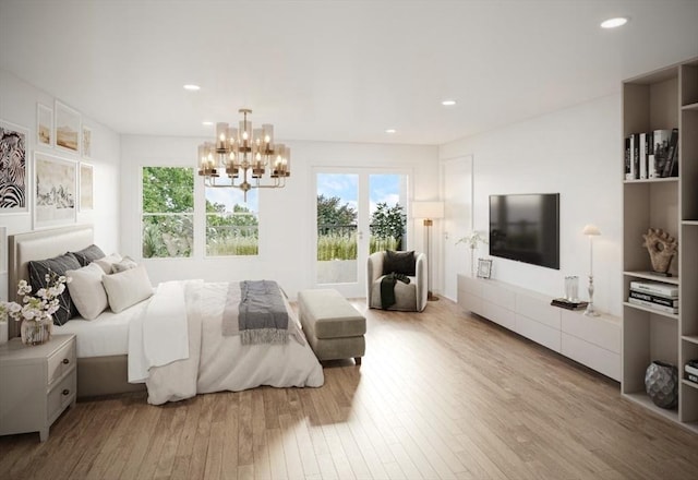 bedroom featuring an inviting chandelier, multiple windows, and light hardwood / wood-style flooring