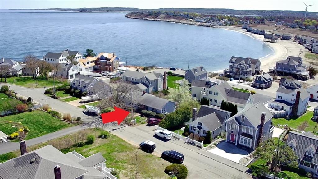 aerial perspective of suburban area featuring a large body of water