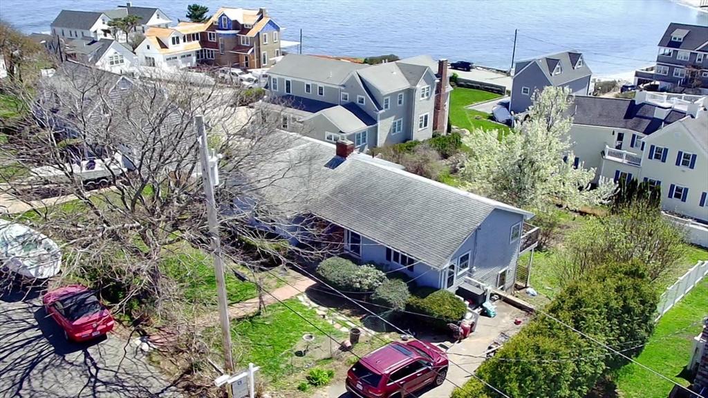 aerial perspective of suburban area featuring a large body of water