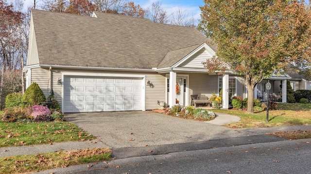 view of front facade with a garage and covered porch