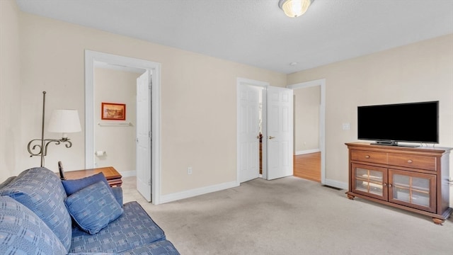 living room featuring light carpet