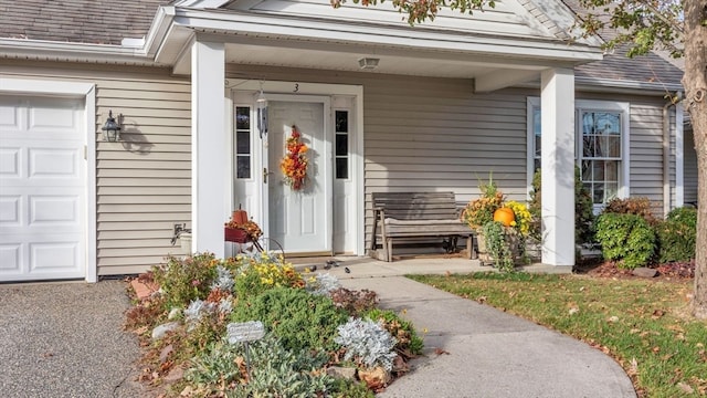 property entrance with a garage