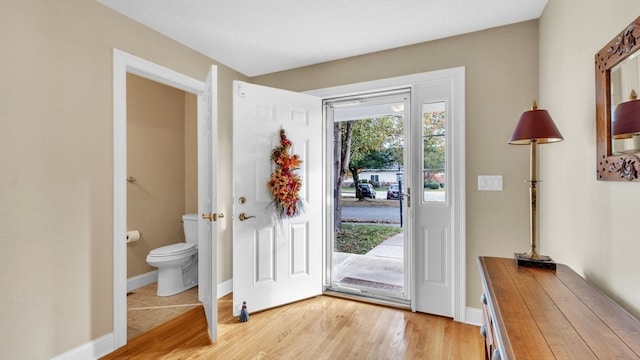 doorway to outside with light hardwood / wood-style flooring