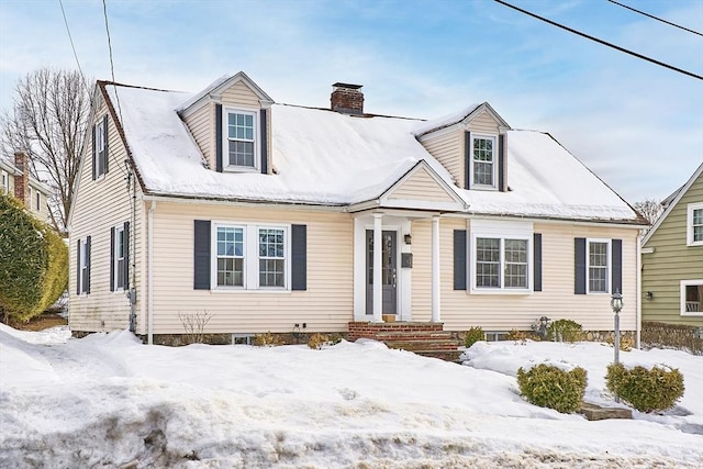 new england style home featuring a chimney