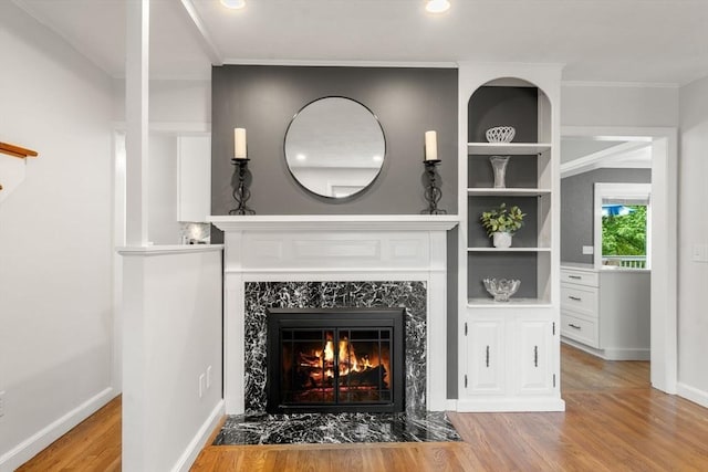 37 Benjamin, Marlborough, MA 01752 - detailed view of a high end fireplace, wood finished floors, baseboards, ornamental molding, and recessed lighting
