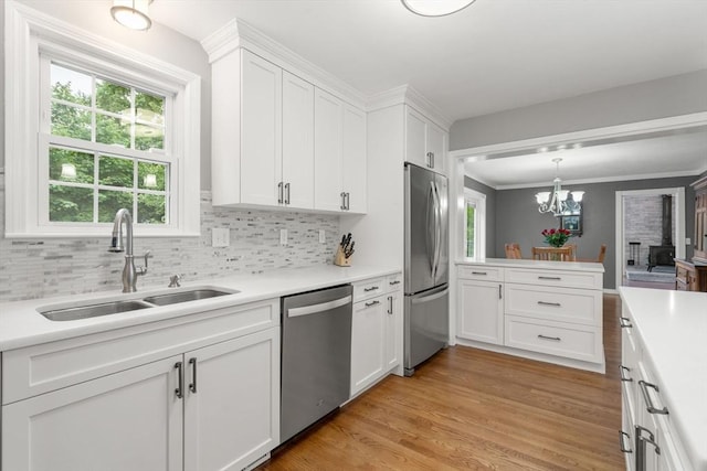 37 Benjamin, Marlborough, MA 01752 - kitchen with appliances with stainless steel finishes, a sink, light countertops, and crown molding