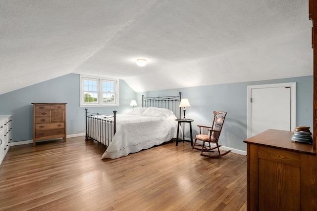 37 Benjamin, Marlborough, MA 01752 - bedroom with a textured ceiling, wood finished floors, vaulted ceiling, and baseboards