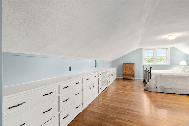 37 Benjamin, Marlborough, MA 01752 - bedroom featuring lofted ceiling, wood finished floors, and a textured ceiling
