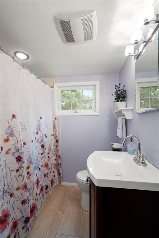 37 Benjamin, Marlborough, MA 01752 - bathroom with vanity, toilet, and curtained shower