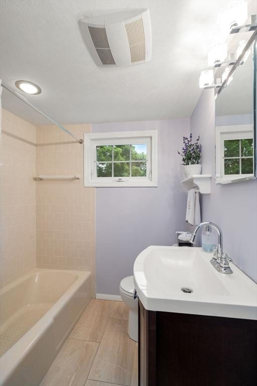 37 Benjamin, Marlborough, MA 01752 - bathroom featuring toilet, vanity, washtub / shower combination, and baseboards