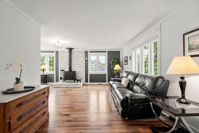 37 Benjamin, Marlborough, MA 01752 - living room with a wood stove, healthy amount of natural light, and hardwood / wood-style floors